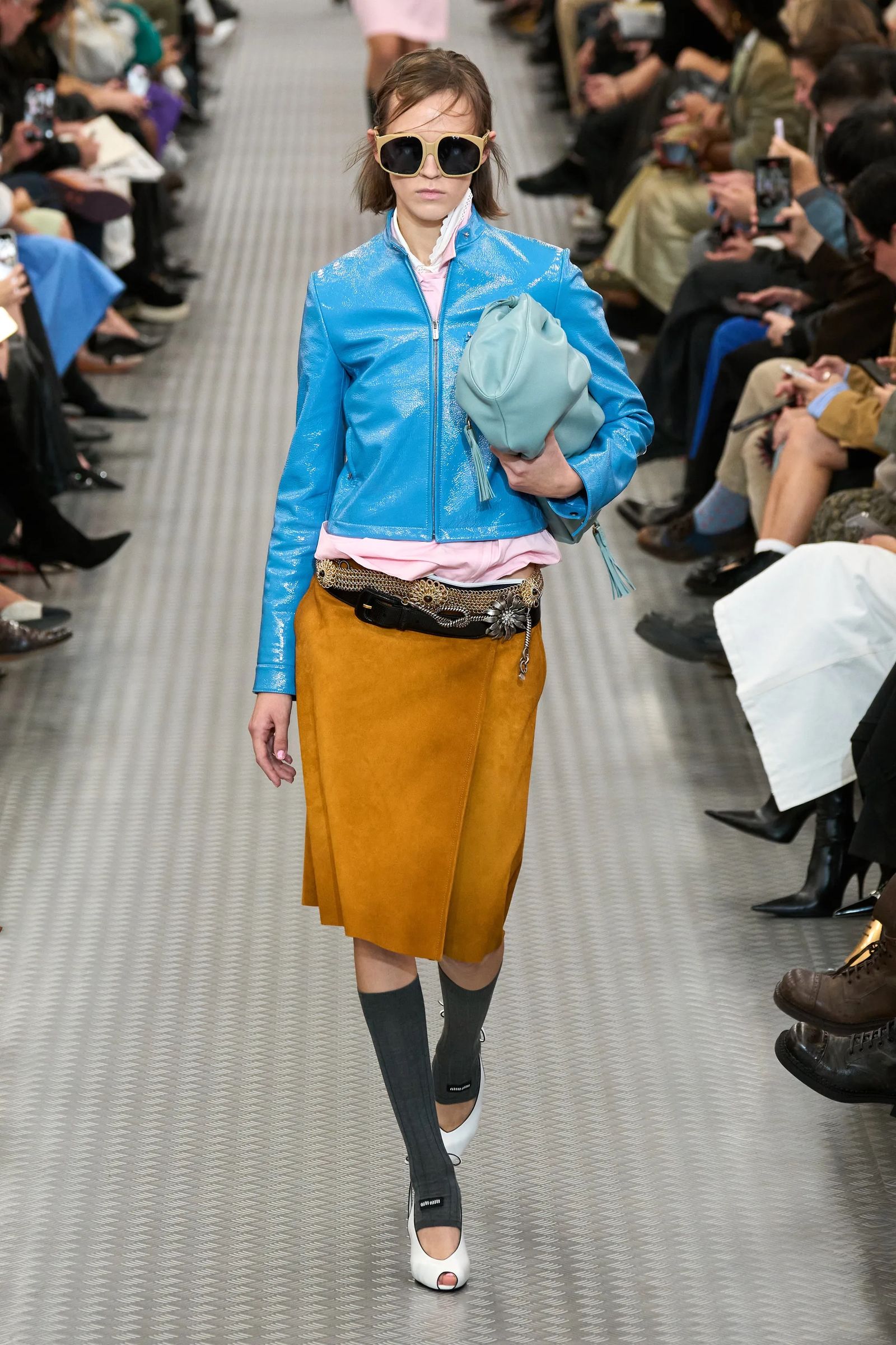 Image may contain Adult Person Clothing Coat Jacket Footwear Shoe Hat Skirt Pants High Heel and Accessories
