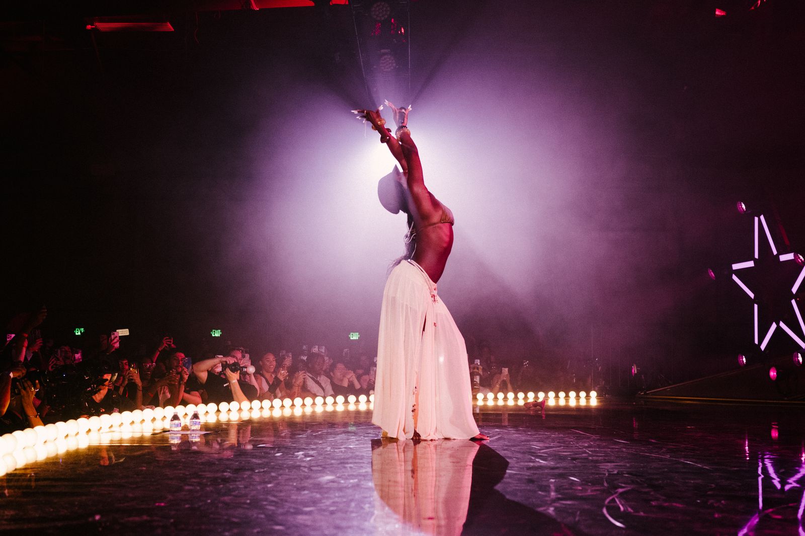 Image may contain Performer Person Solo Performance Adult Lighting Dancing and Leisure Activities