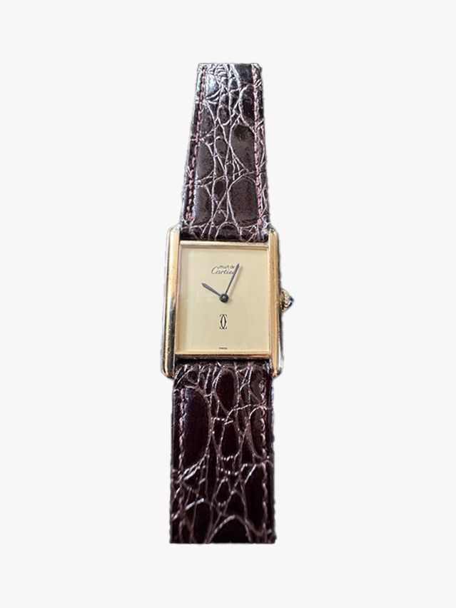 Image may contain: Wristwatch, Arm, Body Part, Person, Accessories, Bottle, Cosmetics, and Perfume