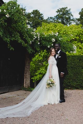 Image may contain Awer Mabil Clothing Dress Face Head Person Photography Portrait Formal Wear Suit and Fashion
