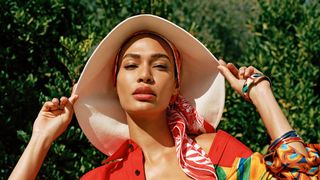 Image may contain Joan Smalls Clothing Hat Beachwear Adult Person Swimwear Sun Hat Accessories and Bracelet