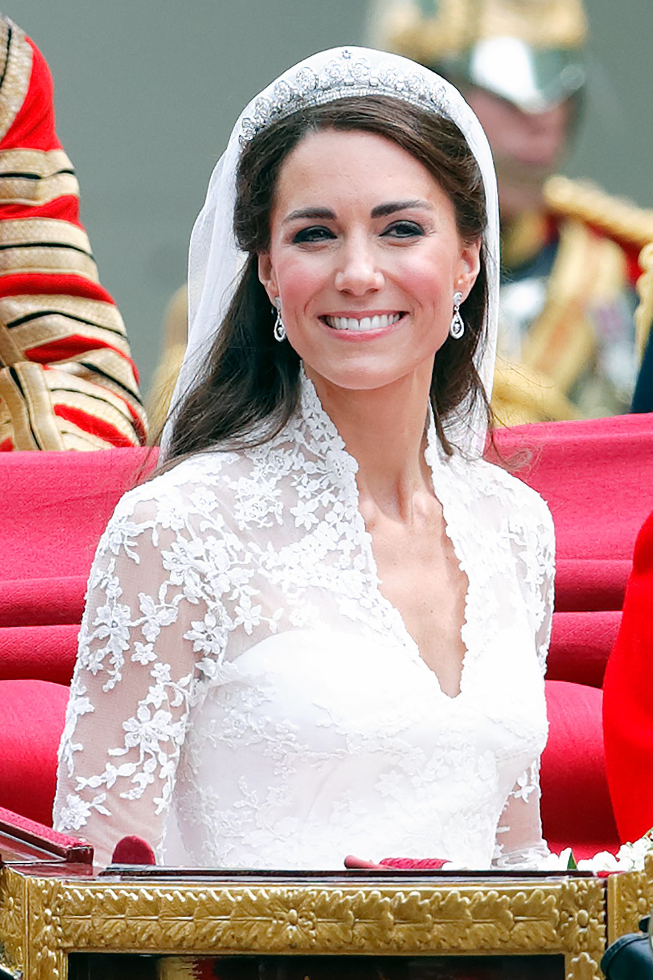 Image may contain Clothing Dress Fashion Formal Wear Gown Wedding Wedding Gown Person Face Head Happy and Smile