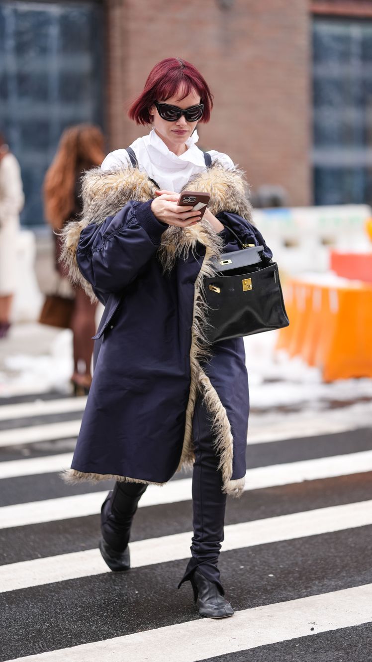 Image may contain Amber Valletta Clothing Coat Pedestrian Person Adult Accessories Glasses Bag and Handbag