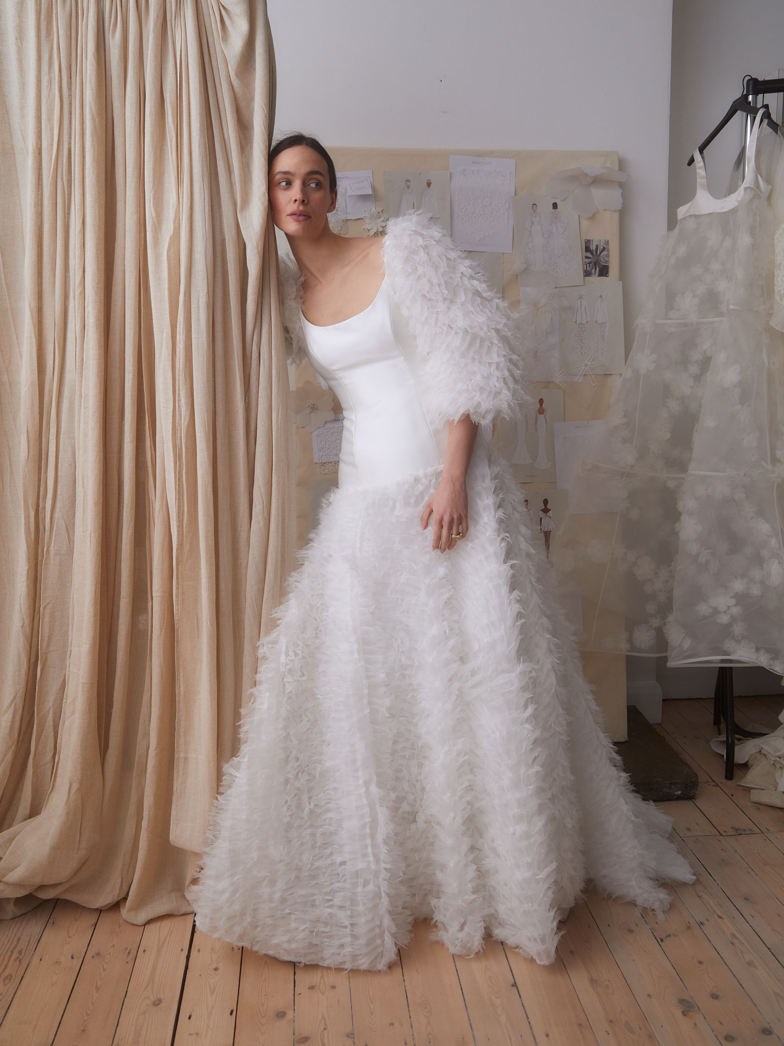 Image may contain Clothing Dress Fashion Formal Wear Gown Wedding Wedding Gown Adult Person and Sleeve