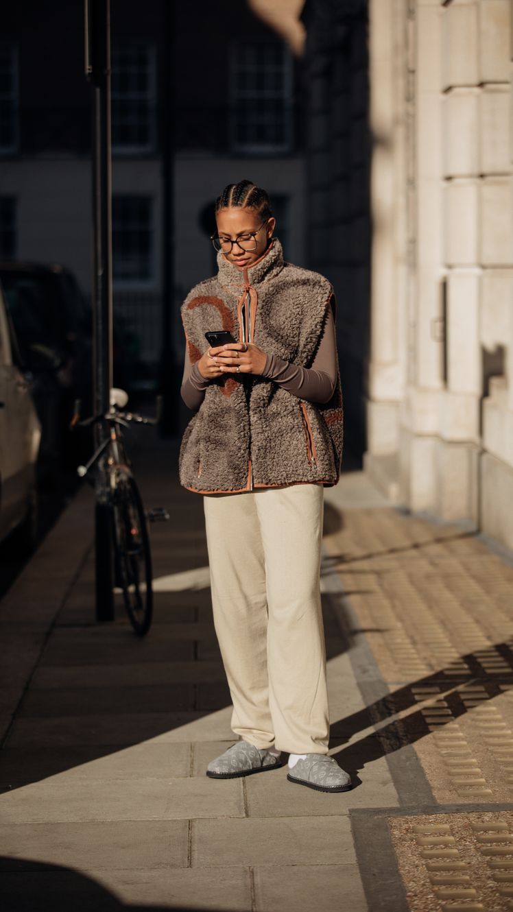 Image may contain Clothing Footwear Shoe Person Standing Adult Accessories Glasses Electronics and Mobile Phone