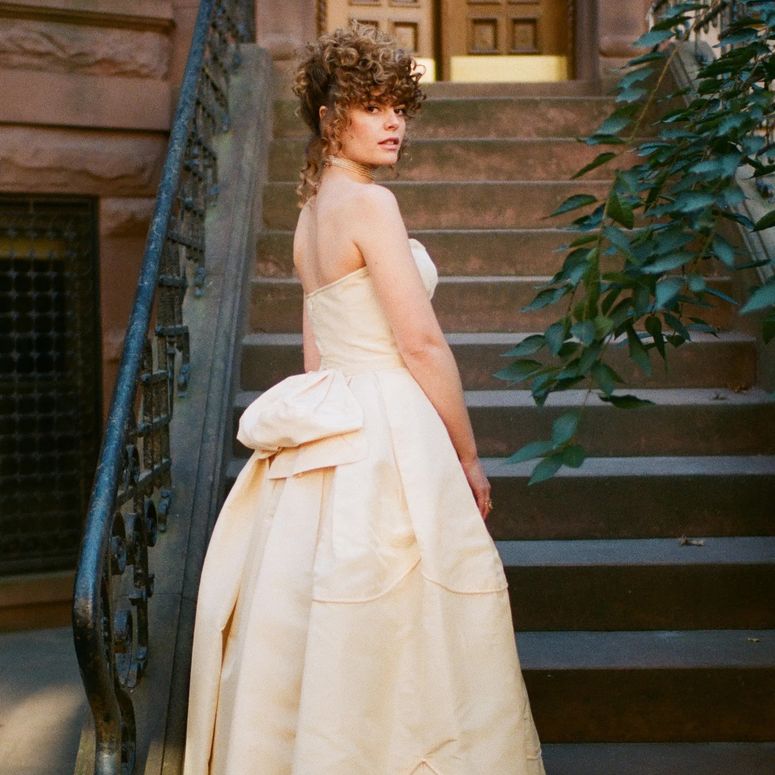 Image may contain: Clothing, Dress, Formal Wear, Architecture, Building, House, Housing, Staircase, Fashion, Gown, and Face