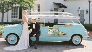 Image may contain Clothing Dress Formal Wear Suit Hat Adult Person Car Transportation Vehicle Footwear and Shoe