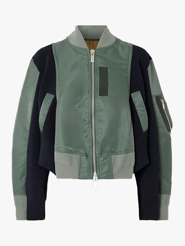 Image may contain Clothing Coat Jacket Vest Knitwear and Sweater