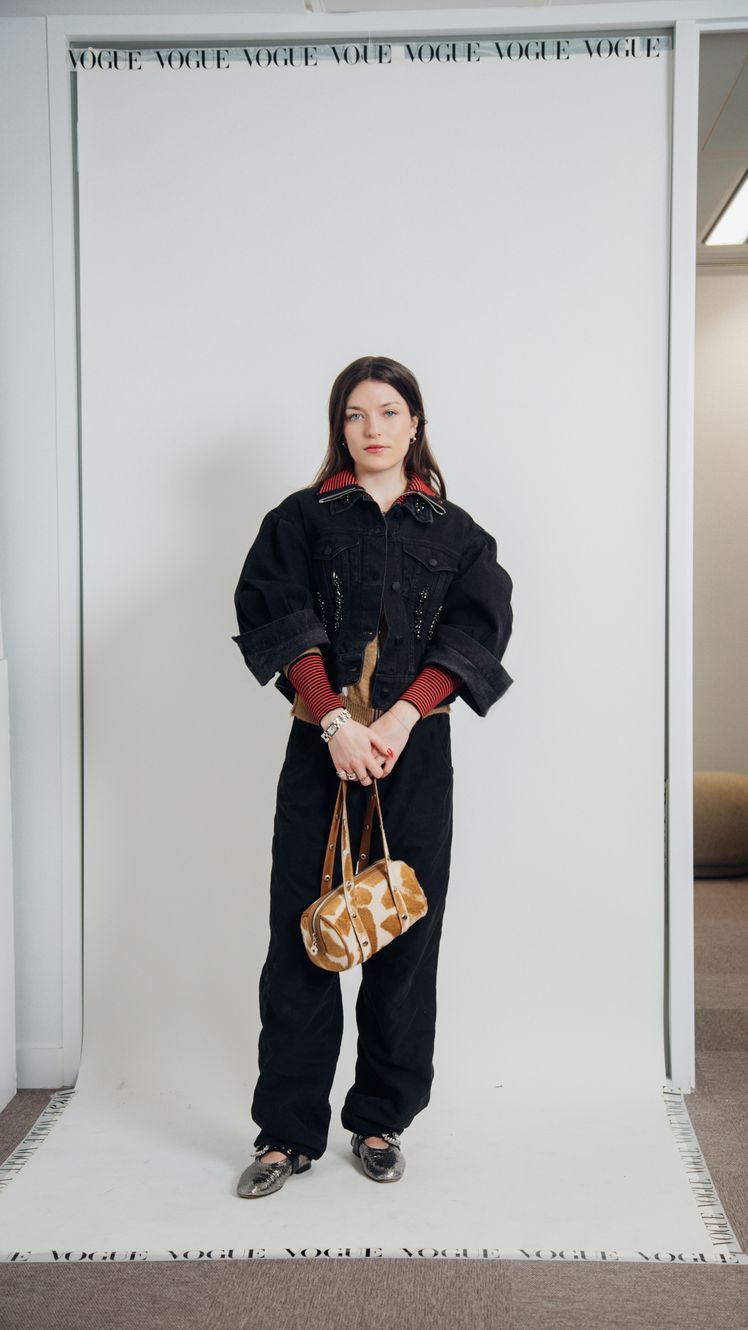 Image may contain DeAnna Pappas Clothing Pants Accessories Bag Handbag Long Sleeve Sleeve Adult and Person