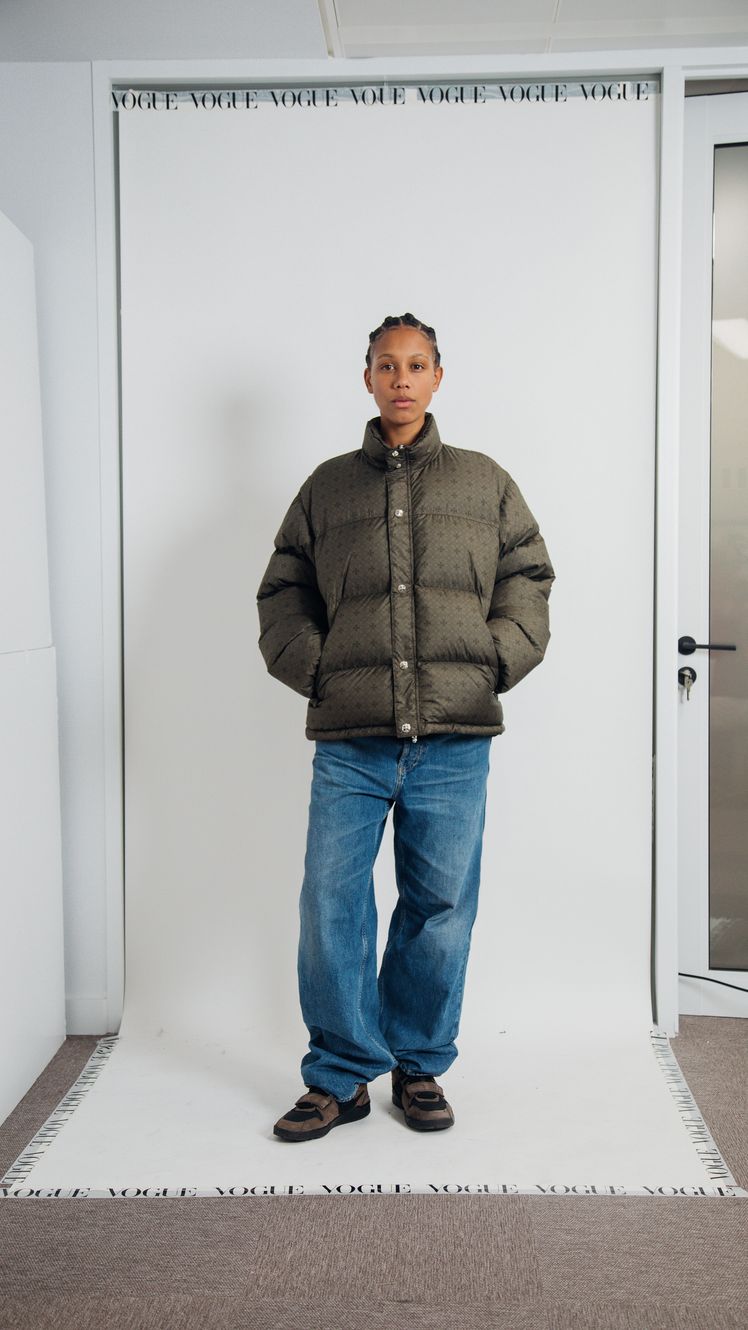 Image may contain Clothing Pants Person Standing Jeans Adult Coat Jacket Footwear Shoe Knitwear and Sweater