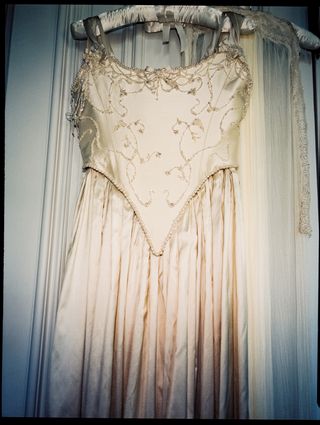 Image may contain Clothing Dress Formal Wear Fashion Gown Wedding Wedding Gown Evening Dress Adult and Person