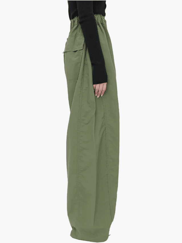 Image may contain Clothing Pants Coat and Skirt