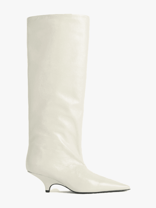 Image may contain Clothing Footwear Shoe Boot Riding Boot and High Heel
