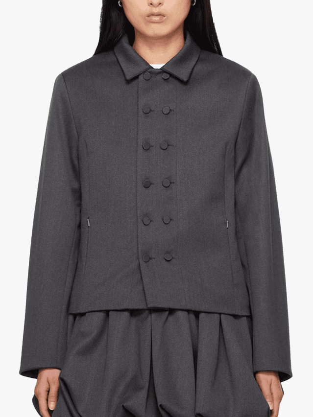 Image may contain Clothing Formal Wear Suit Coat Shirt Long Sleeve Sleeve Blazer Jacket and Tuxedo