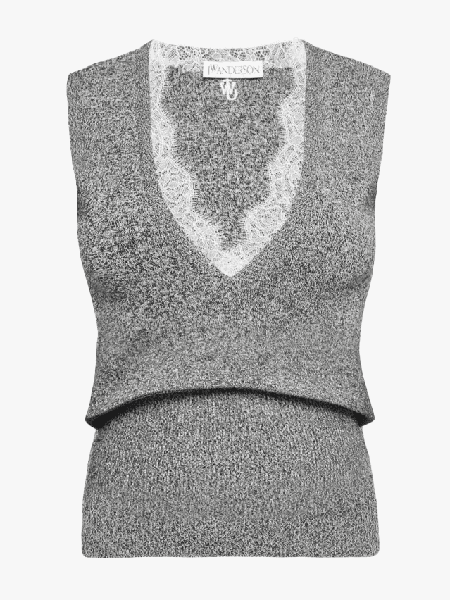 Image may contain Clothing Knitwear Sweater Blouse and Vest
