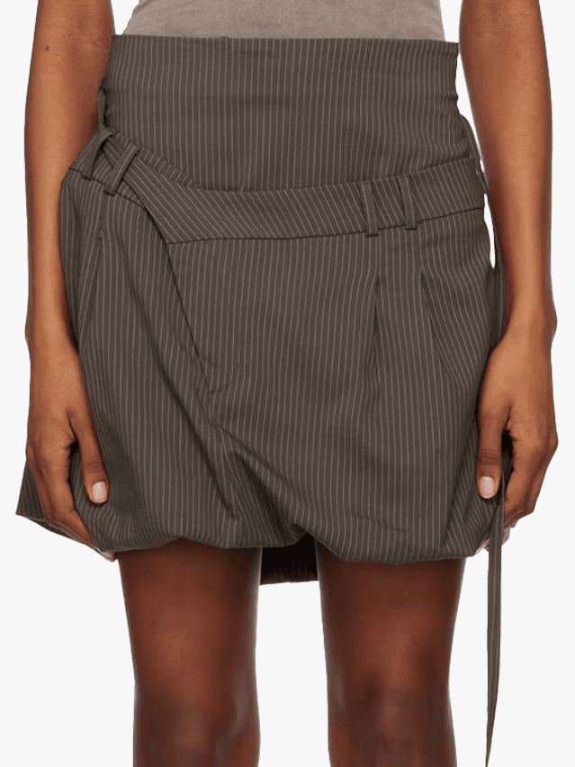 Image may contain Clothing Skirt Miniskirt Blade Dagger Knife and Weapon