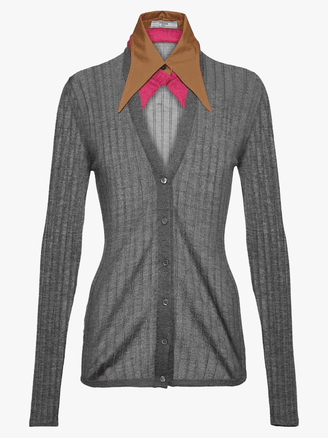 Image may contain Clothing Coat Jacket Blazer Shirt Knitwear Sweater Formal Wear and Suit