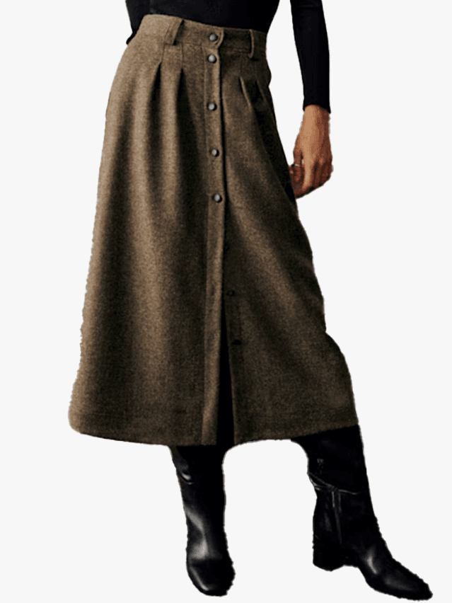 Image may contain Clothing Skirt Coat Footwear and Shoe