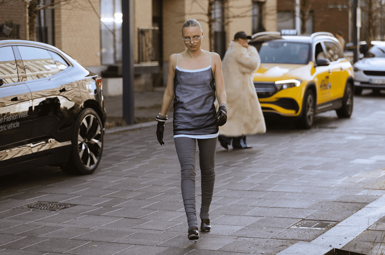 Image may contain Pedestrian Person Accessories Bag Handbag Clothing Pants Walking Alloy Wheel Car and Car Wheel